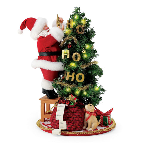 Department 56 Statuina Babbo Natale con albero "Ho Ho Ho" 27x27xH32.5 cm