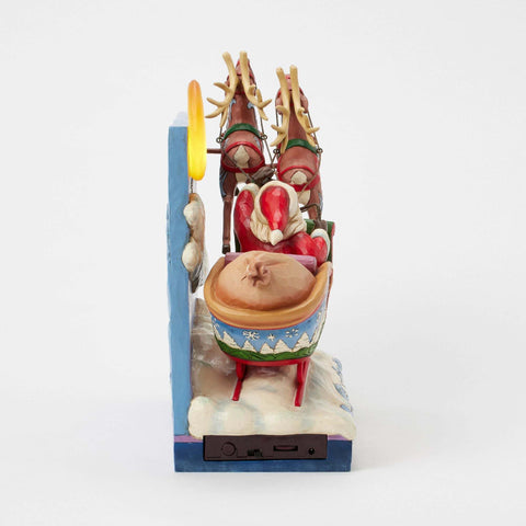 Enesco Slitta Di Babbo Natale Con Renne Musica e luci led, Jim Shore 39x13xH19 cm