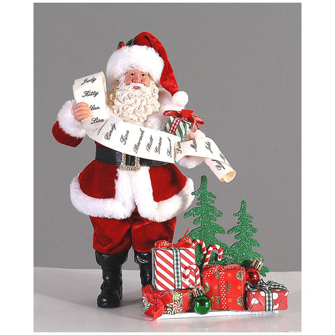 Figurine VETUR Père Noël avec liste de cadeaux et bons d'achat en résine et tissu H28 cm