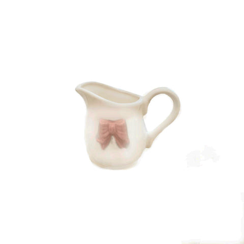 COLLECTION AD REM Pot à lait porcelaine blanche noeud rose 13x10 cm