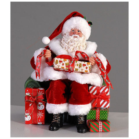 VETUR Figurine Père Noël sur fauteuil avec cadeaux en résine et tissu H23 cm