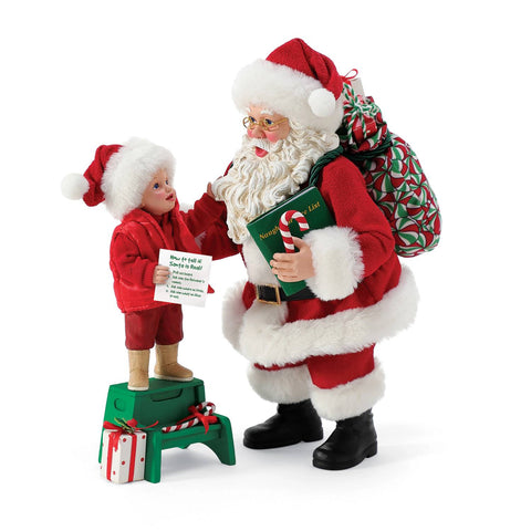 Département 56 Rêves possibles Père Noël en résine avec enfant et cadeaux