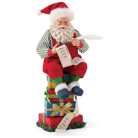 Department 56 Possible Dreams Santa Claus sitting in resin on gift boxes